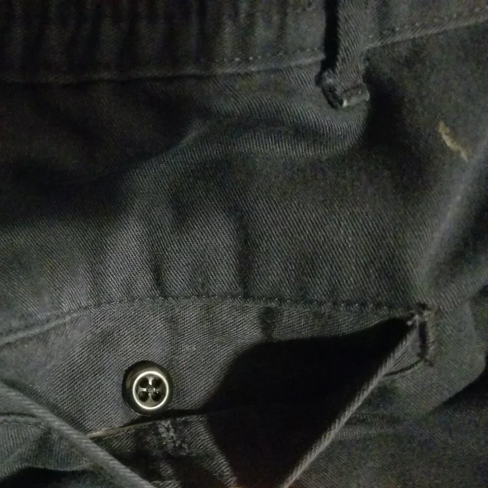 Three stained Cintas men's pants with stretching waistbands